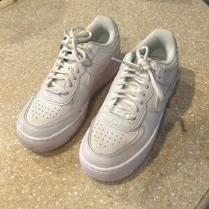 Nike Air Force One’s.   Color: White.     Size: 7.5